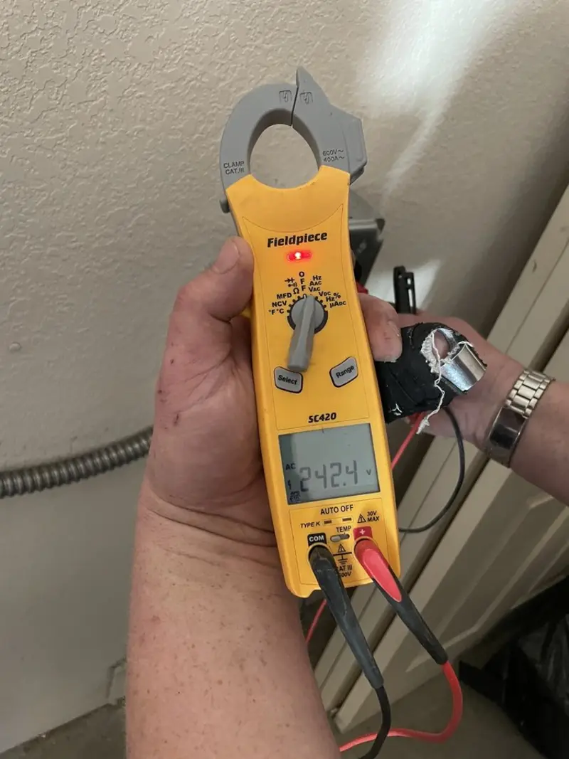 Voltage testing with clamp meter during Ceiling Fan Installation in Hollister